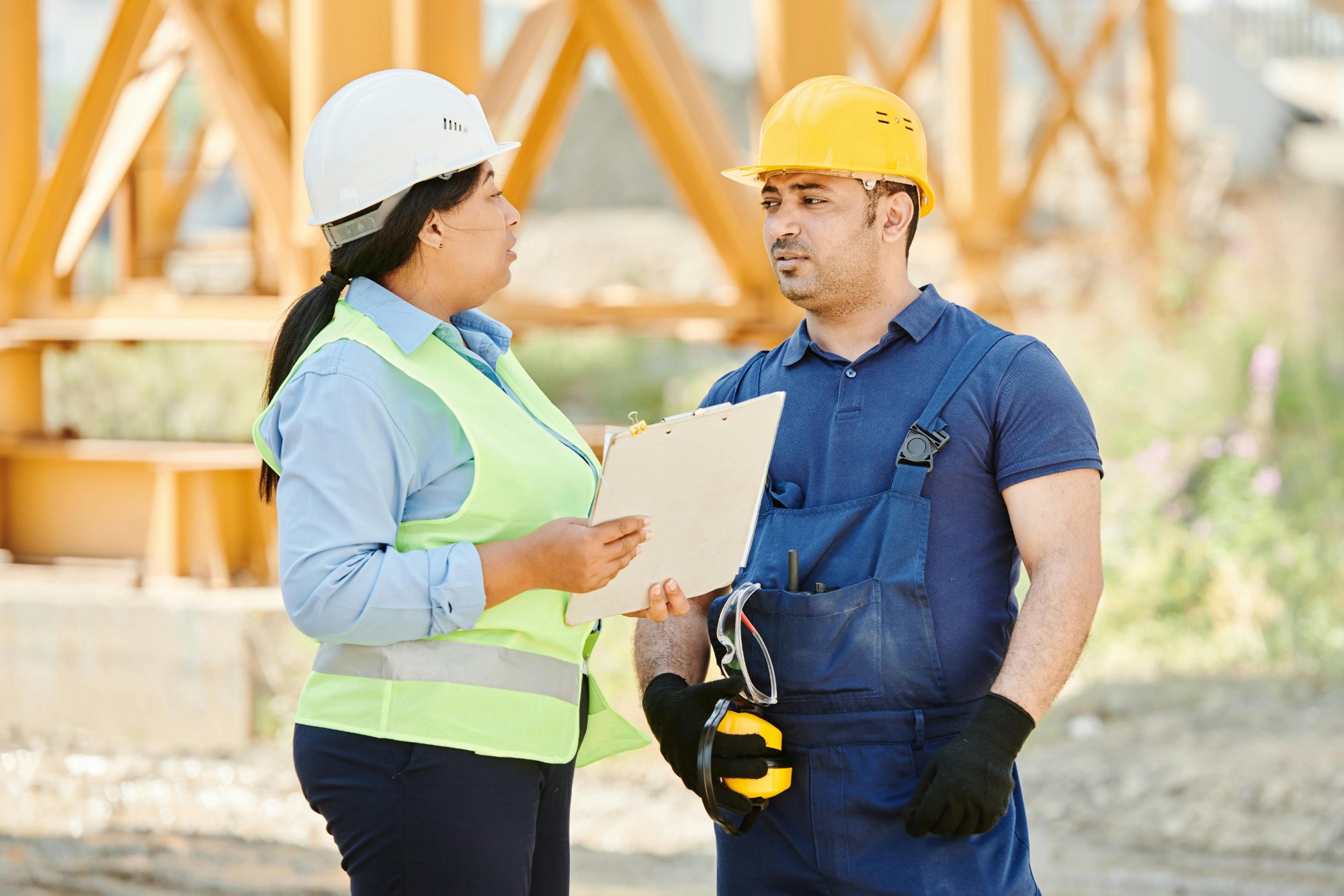 Contractors reviewing paperwork at a job site