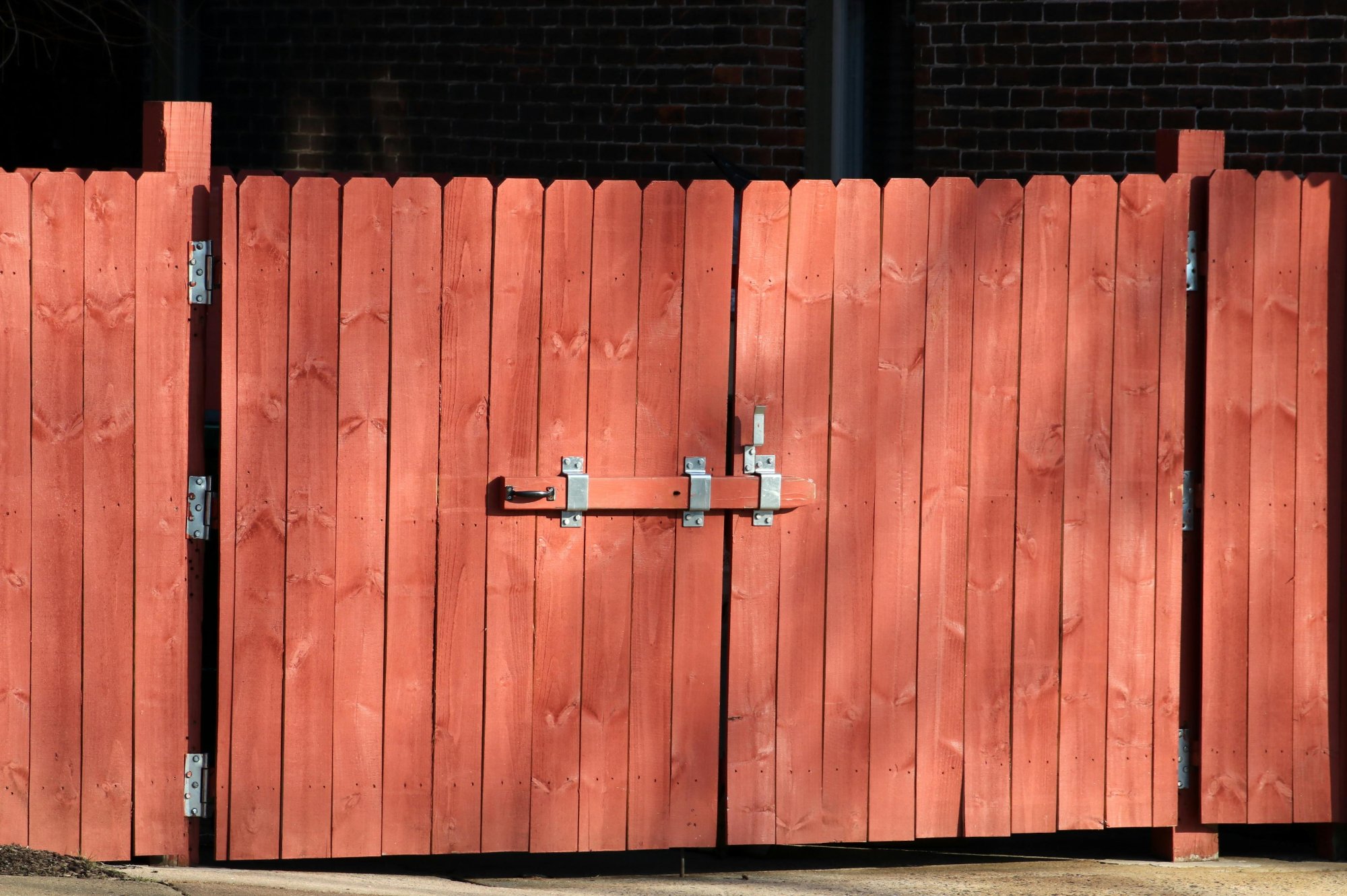 Fence contractor installing fencing