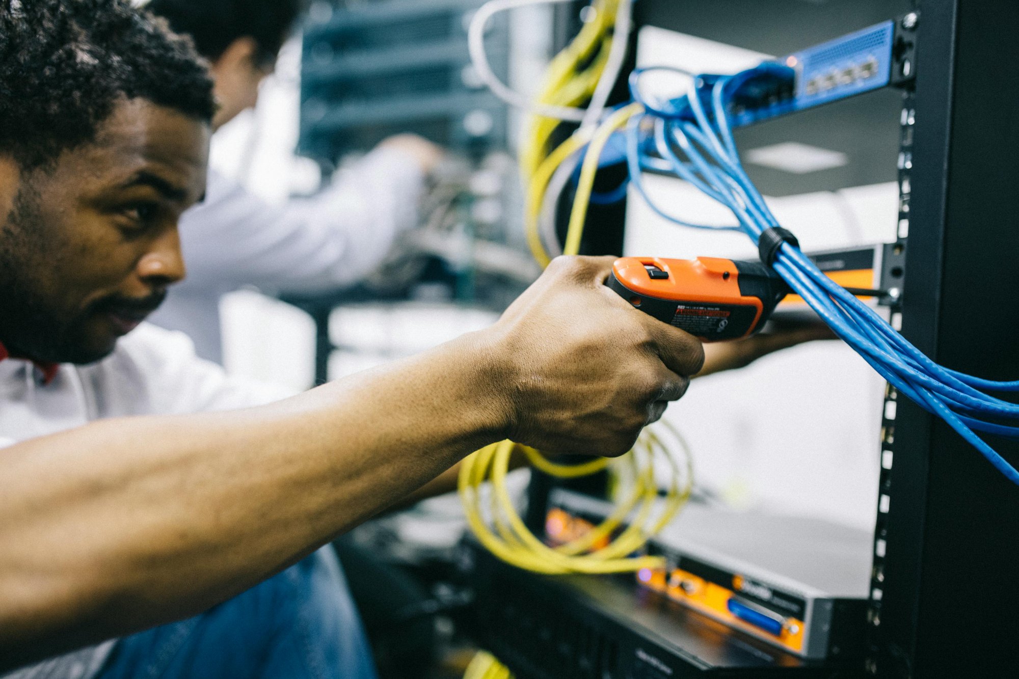 Low voltage technician working on cabling