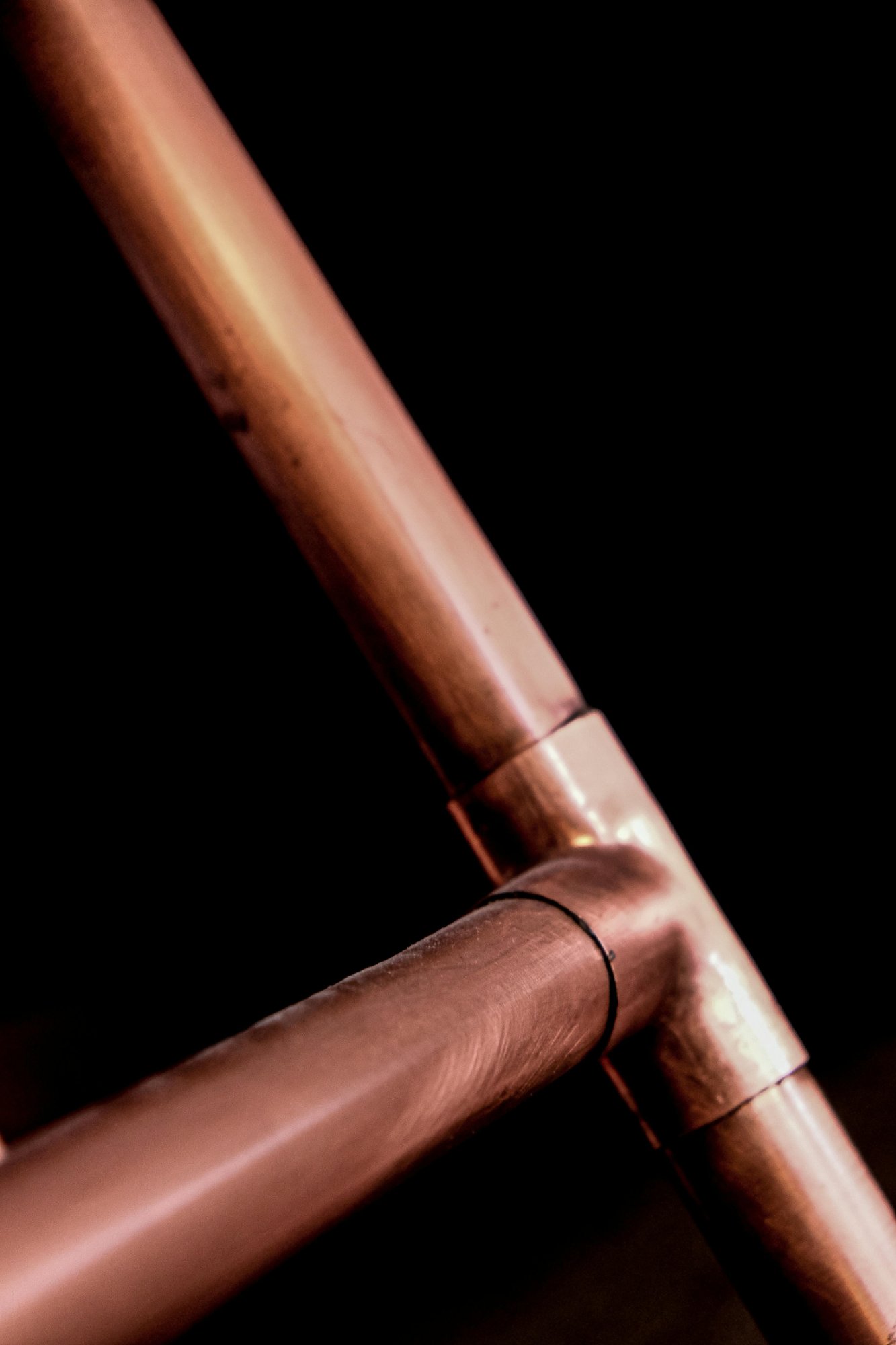 Plumber working on pipes